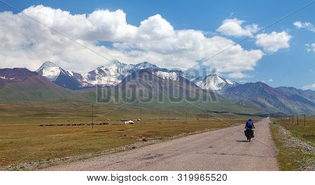 Pamir Highway Or Pamirskij Trakt With Biker. Landscape Around Pamir Highway M41 International Road, 