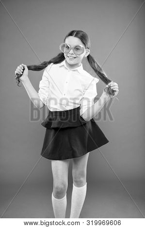 I Am A Girl And I Am Smart. Little Smart Schoolgirl On Orange Background. Adorable Child With Smart 
