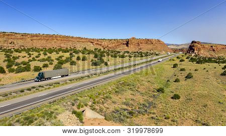 Vehilces Travel Along Close To The Laguna Pueblo Along Highway 40 In The Desert Southwest