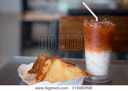 Garlic Bread In White Paper Tray Served With Thai Milk Tea In The Morning