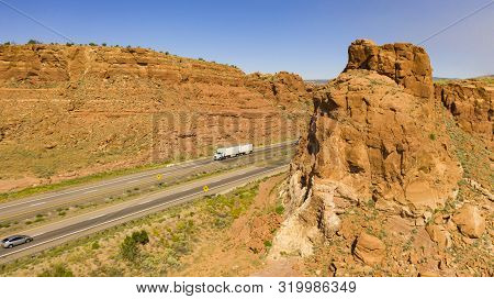 Vehilces Travel Along Close To The Laguna Pueblo Along Highway 40 In The Desert Southwest