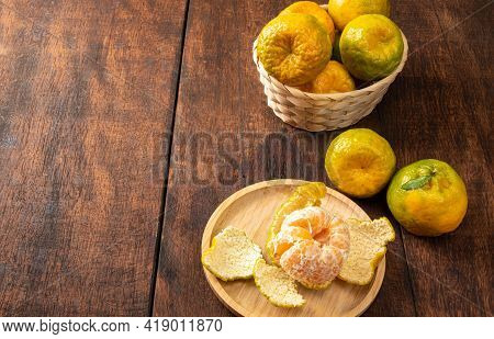 Orange Ponkan, Orange Ponkan In A Basket On Rustic Wooden Light Background, Selective Focus.