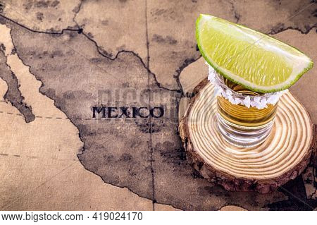 Glass Of Tequila With Map Of Mexico In The Background, Image To Celebrate Tequila Day