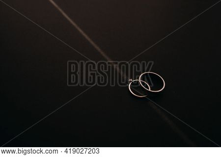 Silver Or Titanium Wedding Rings  On Black Background
