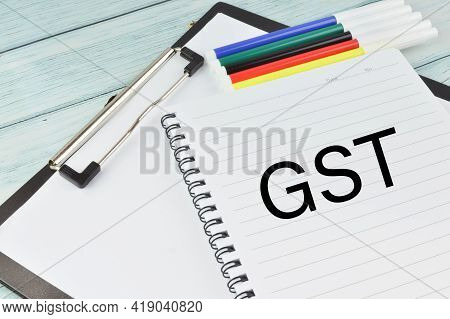 Notebook Written With Gst. Gst Is A Goods And Services Tax