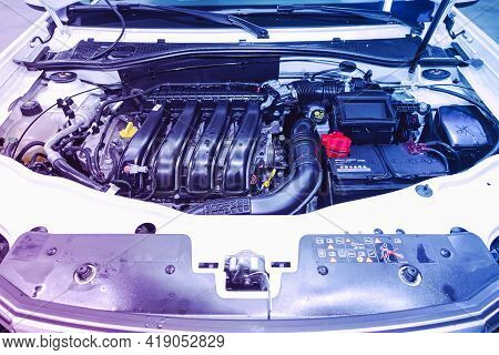 Novosibirsk, Russia - April 25 2021: Nissan Terrano,  Under The Hood Of Car. Powerful Engine Closeup