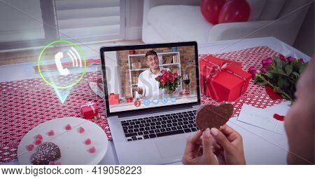 Composition of digital interface with call icon over man with roses on valentine's day on laptop. global networking, romance, love, communication and technology concept digitally generated image.