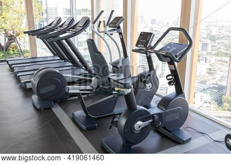 Sports Equipment In The Gym. Modern Gym Interior With Equipment. Cardio Machine In Gym With Modern F