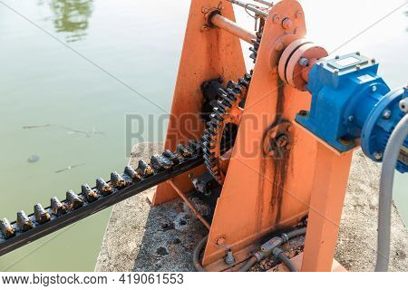 Metal Mechanical Gear On The Floodgate. Water Lock Gate Control Gears. Gears Of The River Flood Dam.