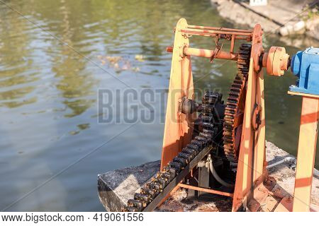Metal Mechanical Gear On The Floodgate. Water Lock Gate Control Gears. Gears Of The River Flood Dam.
