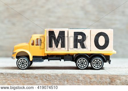 Toy Truck Hold Alphabet Letter Block In Word Mro (abbreviation Of Maintenance, Repair And Overhaul O