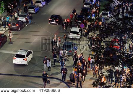 Thessaloniki, Greece - May 01 2021: Orthodox Easter 2021 Anastasi Resurrection. Faithful Wearing Fac