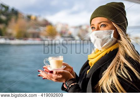 Woman Drinking Masala Tea In The Front, Bosphorus Bay In The Background