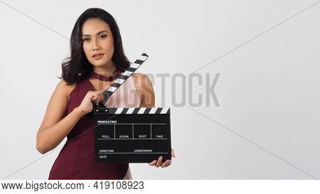 Asian Woman Is Holding Clapper Board Or Movie Slate Use In Video Production ,film, Cinema ,movies In