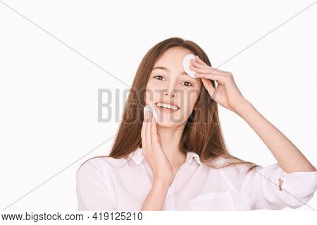 Pretty Girl Indoor Portrait. Light Background. Female Teenager Person. Long Brow Hair. Cleansing Dir