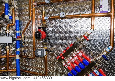 Plumbing Services. Stainless Steel Piping Of The Heating System In The Boiler Room. Heating Thermore