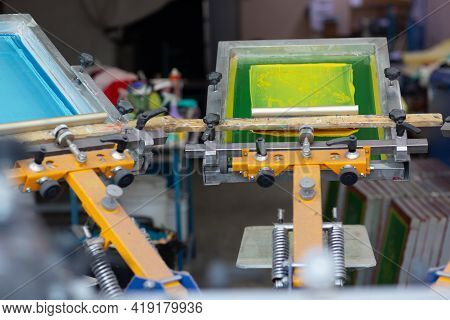 Carousel Frame, Squeegee And Plastisol Color Paint Serigraphy Silk Screen Print Process At Clothes F