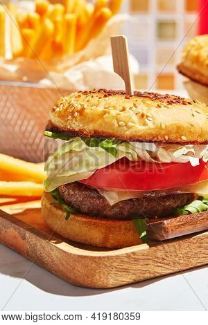 Delicious Homemade Burgers On Wooden Tray In Bright Sunlight. Burgers With Veal Cutlet, Pamidor, Che