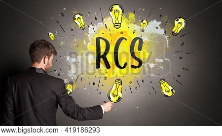 man drawing colorful light bulb