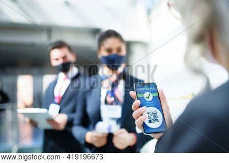 Senior Woman Showing Smartphone With Covidpass, Coronavirus, Travel And New Normal.
