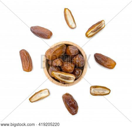 Dry Dates Palm In Wooden Bowl Isolated On White Background.
