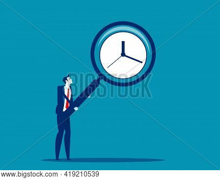 Businessman Holding A Big Magnifying Glass Showing Clock