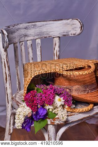 Stillife With Lilak Flowers And Hat On Vintaje Cher