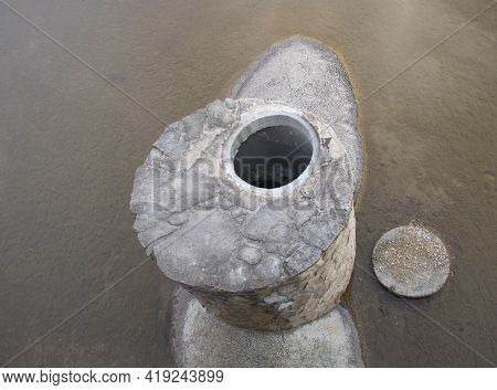 Overflow Pipe In The Lake Made Of Concrete