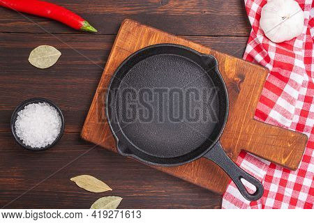 Empty Cutting Board On Wooden Table And Spice, Pepper, Salt. Cookung Food Background For Menu In Rus