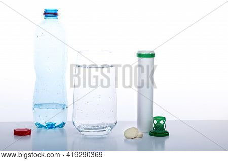 Glass Filled With Mineral Water. Mineral Water On A White Background. Water And Medicines. Front Vie