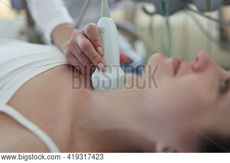 Doctor Conducts Ultrasound Examination Of Patient Thyroid Gland