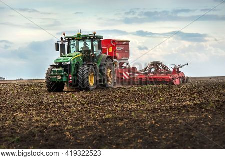 Baykivtsi, Ternopil Region, Ukraine - April 20, 2021: Farmers Sow, Apply Fertilizer Using A John Dee