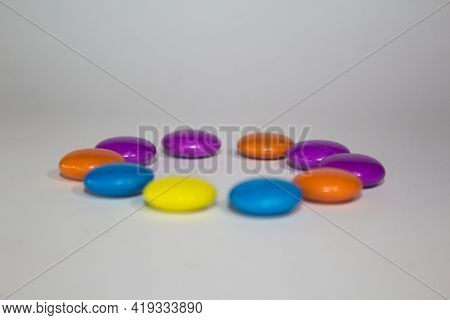 Close Up Of Gems Chocolate Candy With White Background
