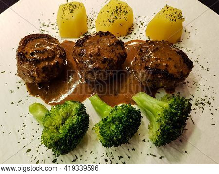 Fried Meatballs With Boiled Broccoli And Parsley Potatoes