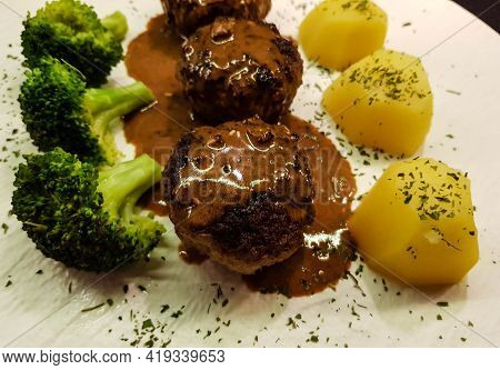Fried Meatballs With Boiled Broccoli And Parsley Potatoes