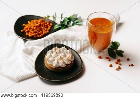 Sea Buckthorn Tea And Dessert On A White Background
