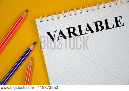 The Variable Written On White Notepad And Yellow Background. Word