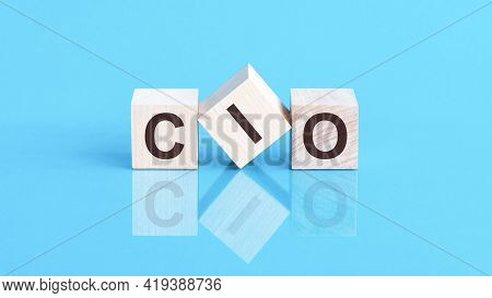 Cio Word Written On Wood Block. Cif Word Is Made Of Wooden Building Blocks Lying On The Blue Table, 