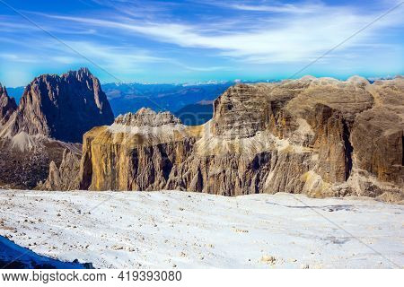  Warm sunny day in the Alps. The Passo-Pordoi pass. Pordoi is a mountain pass of the Dolomites, located between the Sella mountain range and the Marmolada mountain