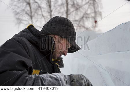 Portrait Of A Worker In A Black Cap