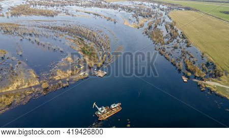 Dredger Is Working To Deepen The Fairway On The River. Cleaning And Deepening By A Dredger On The Ri