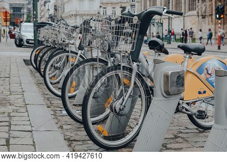 Brussels, Belgium - August 16, 2019: Row Of Villo Bikes, A Public Bicycle Rental Programme, On A Str