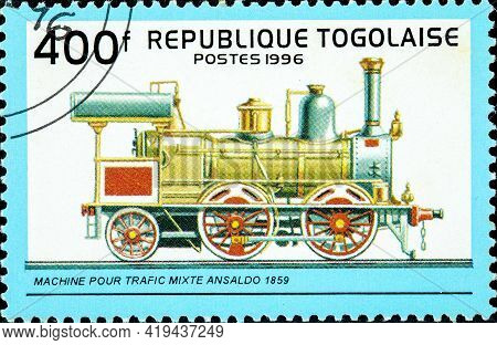 Togo - Circa 1996: A Stamp Printed In Togo Shows An Old Railroad Steam Engine Locomotive Made By The