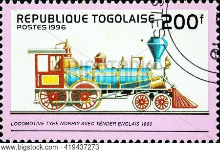 Togo - Circa 1996: A Stamp Printed In Togo Shows An Old Norris Type Locomotive From 1866, Circa 1996