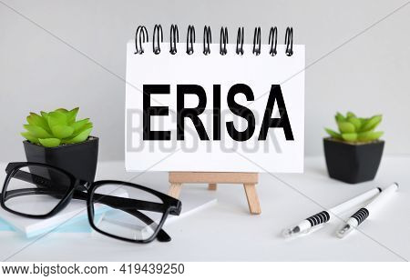 Employee Retirement Income Security Act Erisa. Text On White Paper, Notebook On A Stand On A Light B