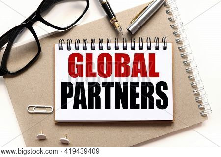 Global Partners. Business Concept. Text On White Paper On Notepad. On White Background