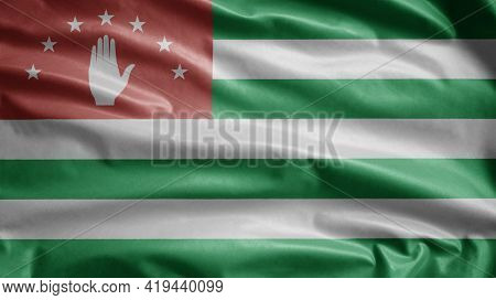 Abkhazian Flag Waving In The Wind. Close Up Of Abkhazia Banner Blowing, Soft And Smooth Silk. Cloth 