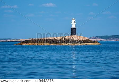 Lighthouse In The Archipelago Near Fjaellbacka In Sweden.