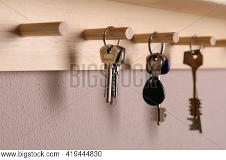 Wooden Hanger For Keys On Color Wall, Closeup
