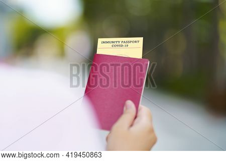 Passport With Vaccination Certificate For Covid-19 Person Record Card. Immune Passport Or Certificat